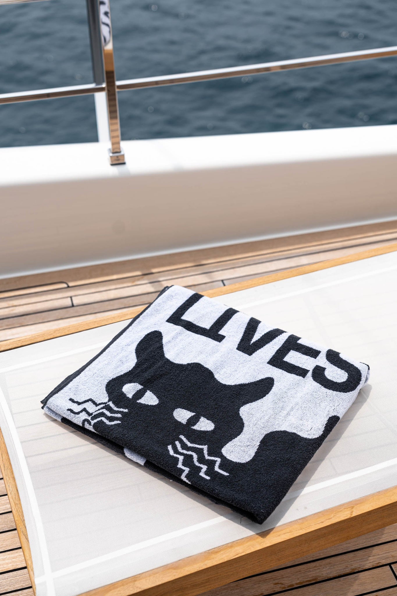 Alex khabbazi black and white cat nine lives beach towel