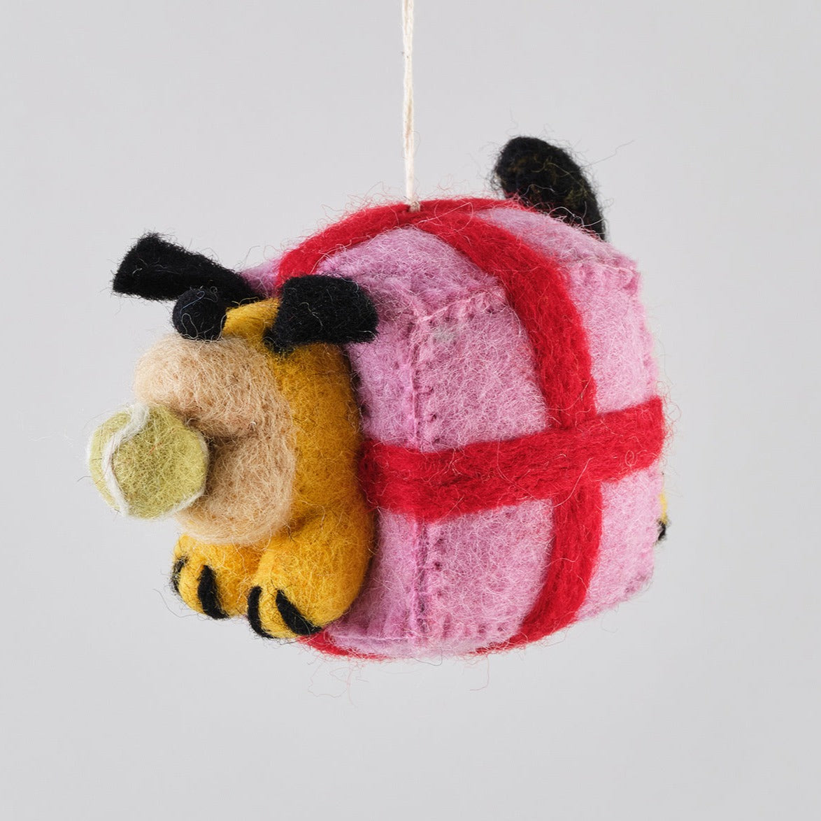 yellow dog in pink present box christmas hanging decoration