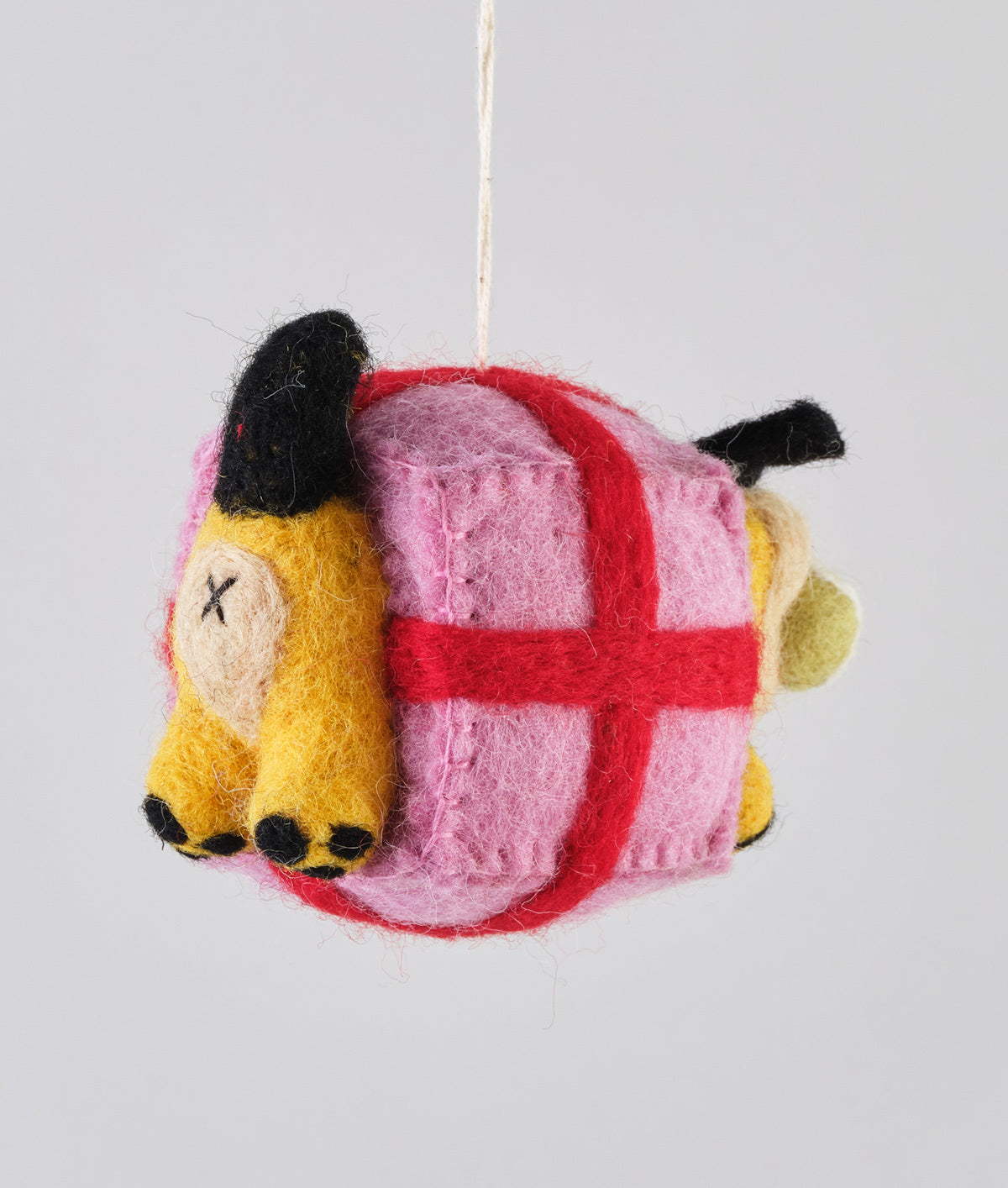 yellow dog in pink present box christmas hanging decoration