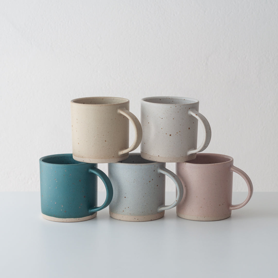 White ceramic mug hand thrown by Dor & Tan