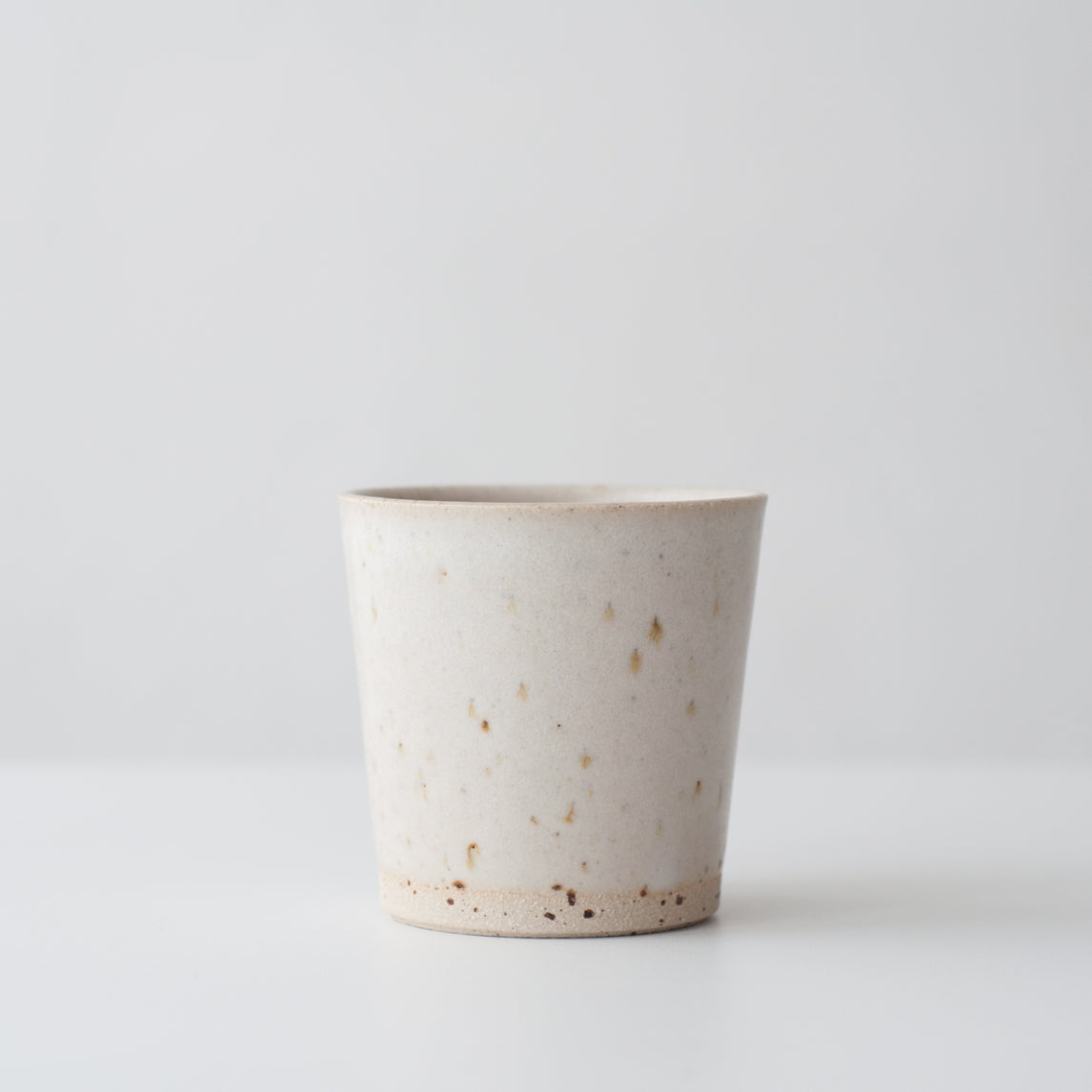 Matte white hand thrown ceramic beaker mug by Dor & Tan