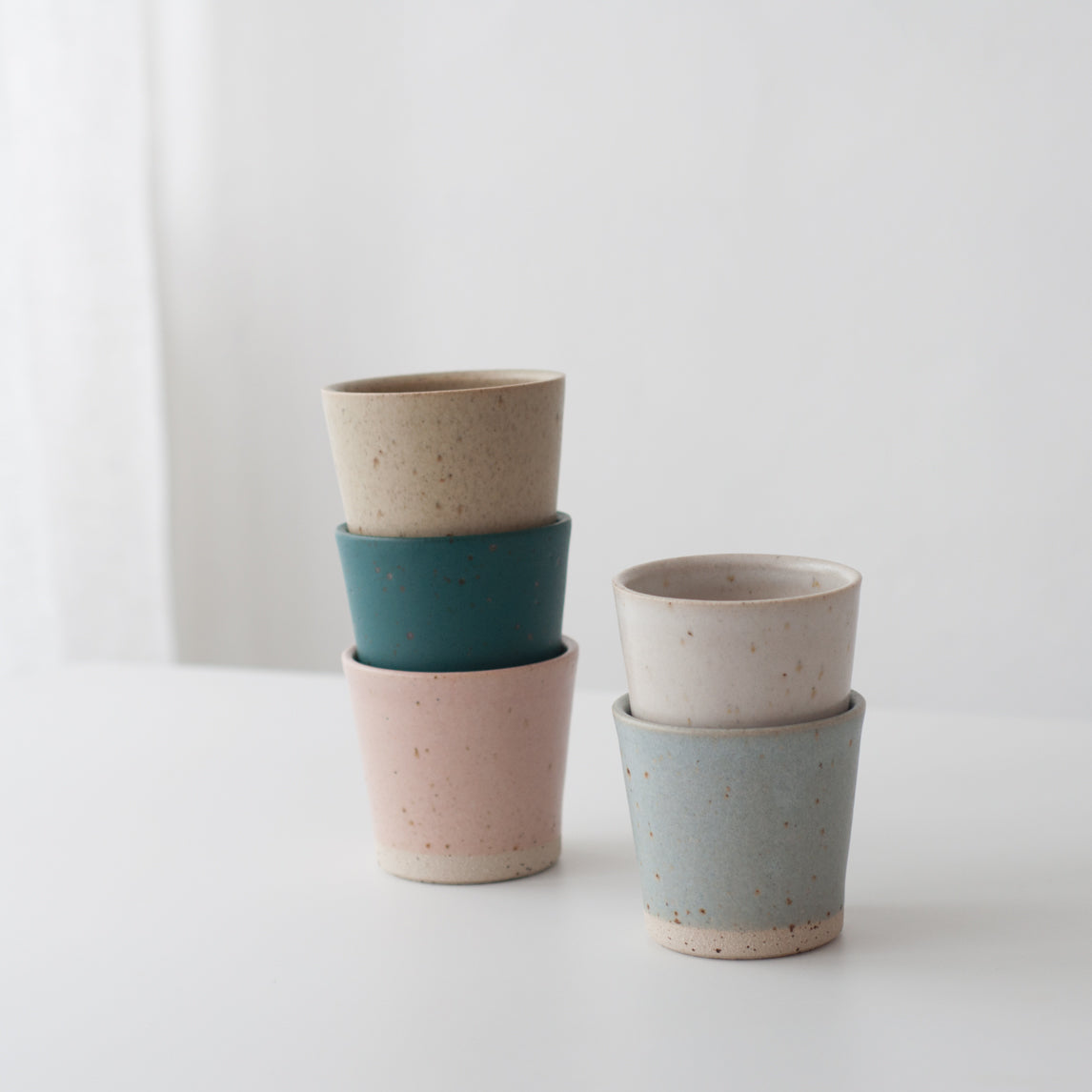Green hand thrown ceramic beaker mug by Dor & Tan