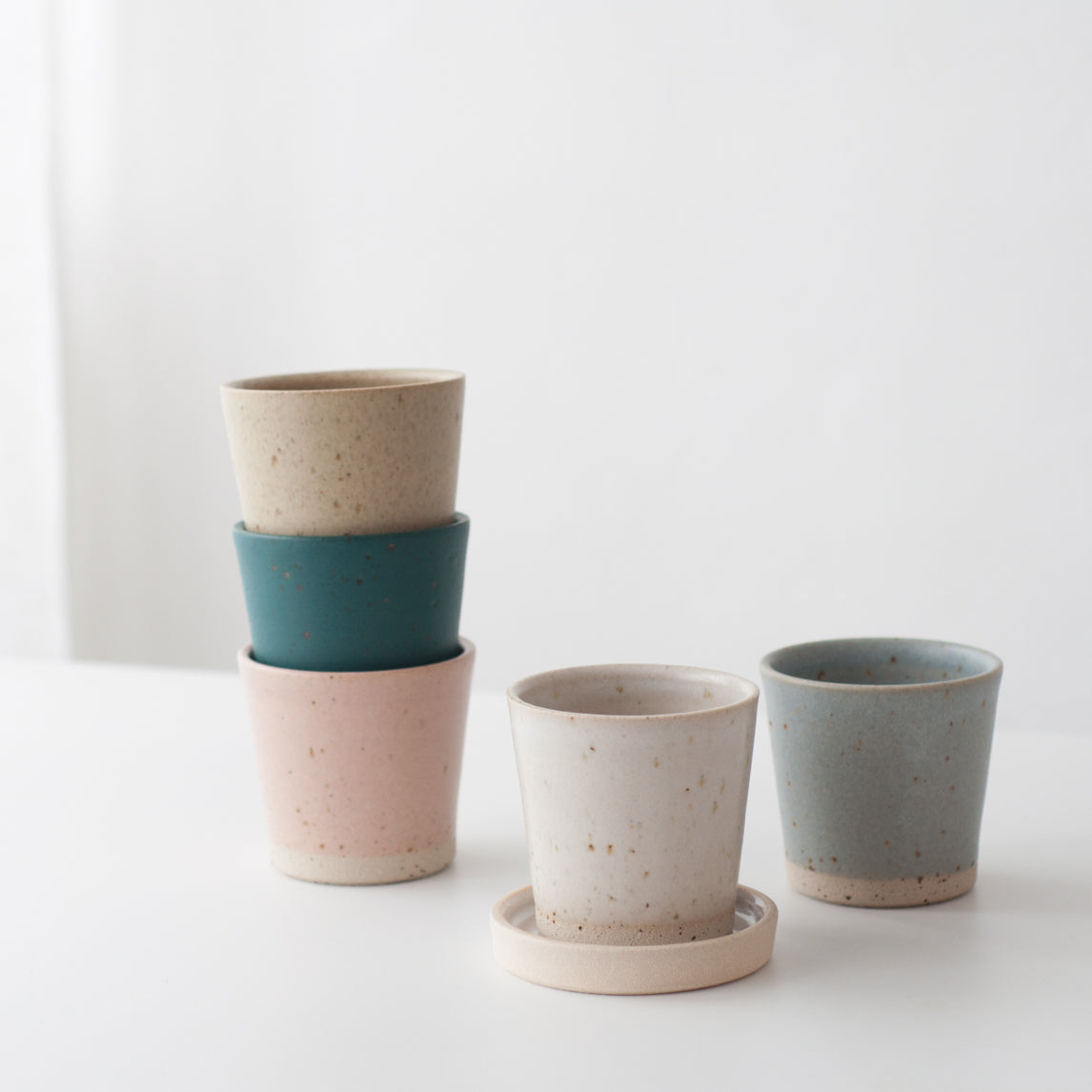 Pink hand thrown ceramic beaker mug by Dor & Tan