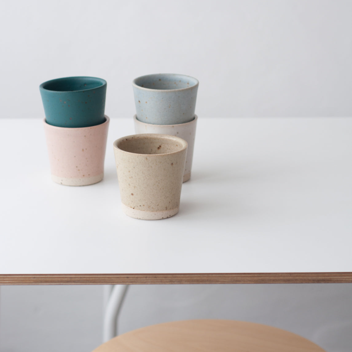 Green hand thrown ceramic beaker mug by Dor & Tan