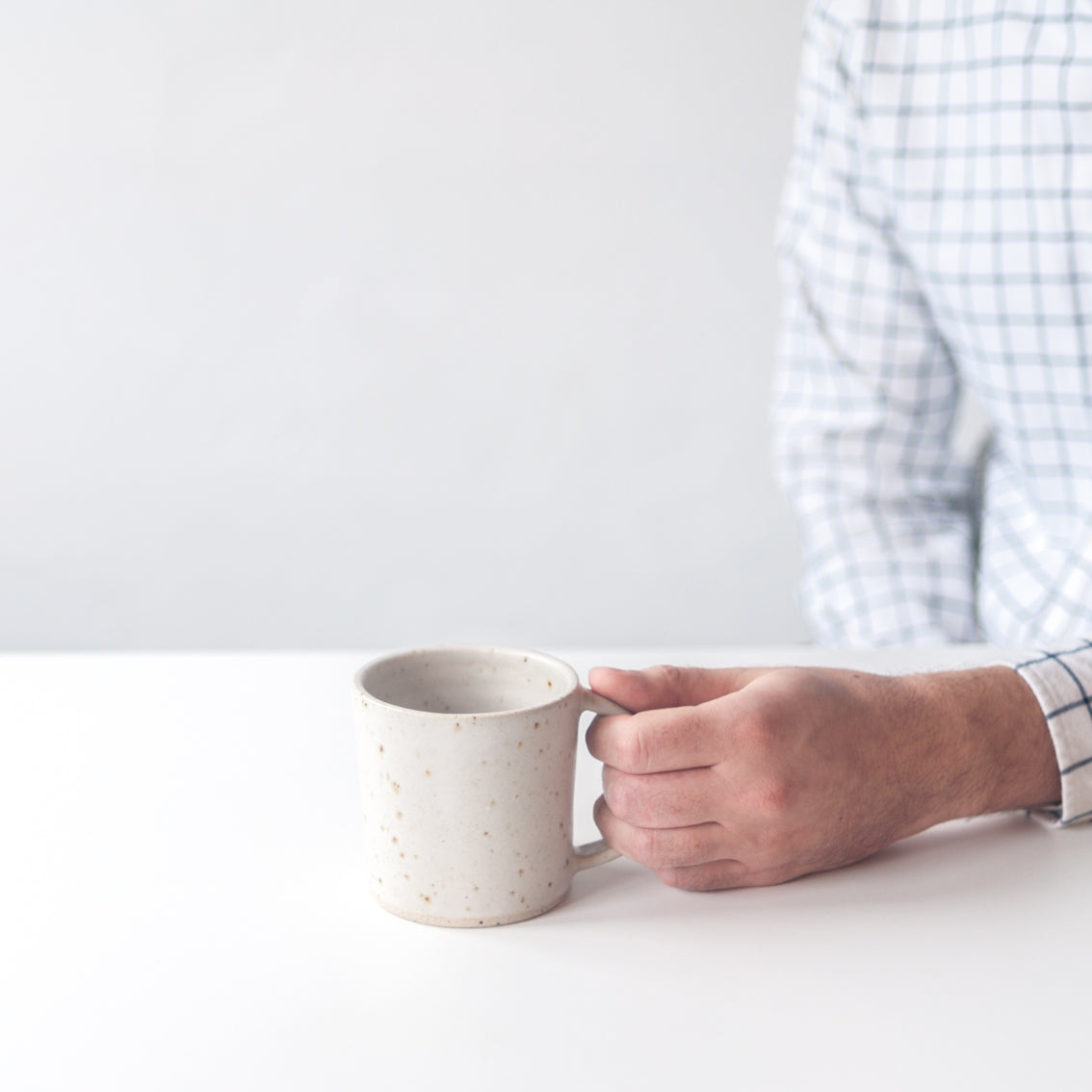 White ceramic mug hand thrown by Dor & Tan