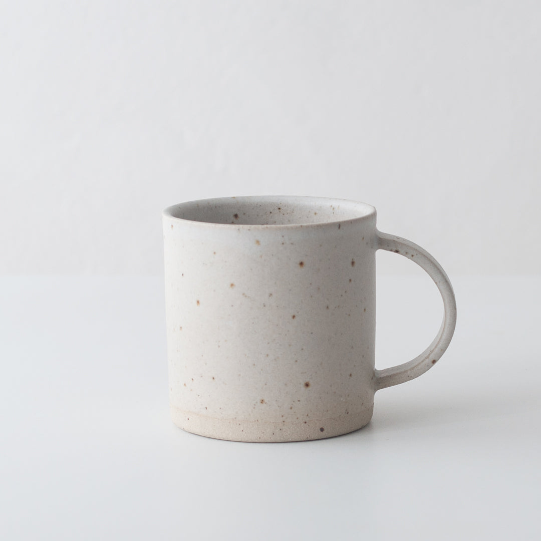 White ceramic mug hand thrown by Dor & Tan