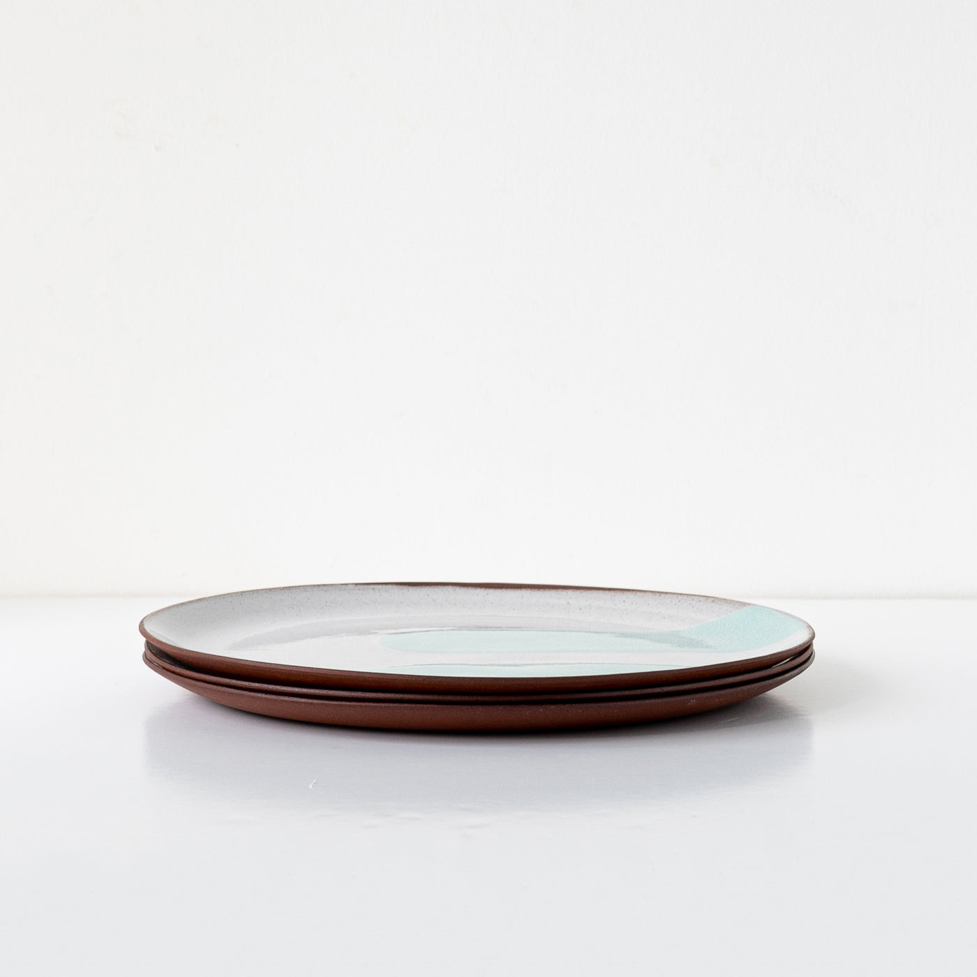 Silvia K hand made terracotta plate with white and 2 pale yellow decor