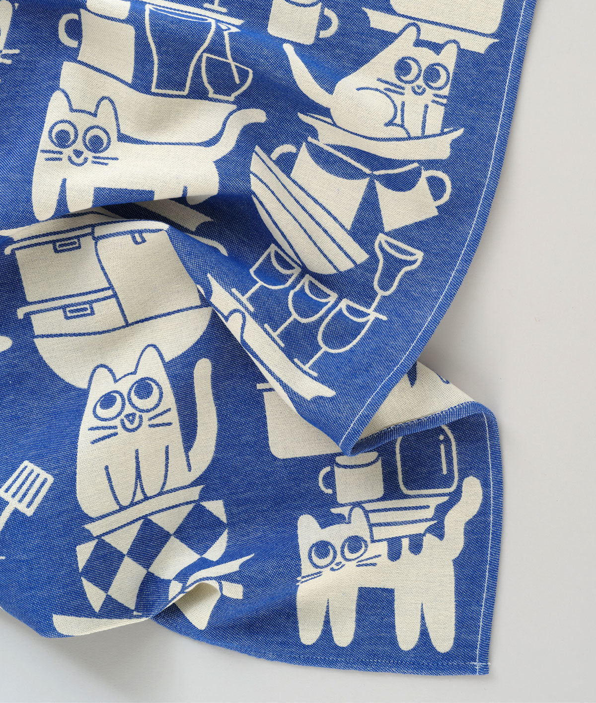 Blue and white cat illustrated tea towel by Elliott Kruszynski for Wrap Magazine