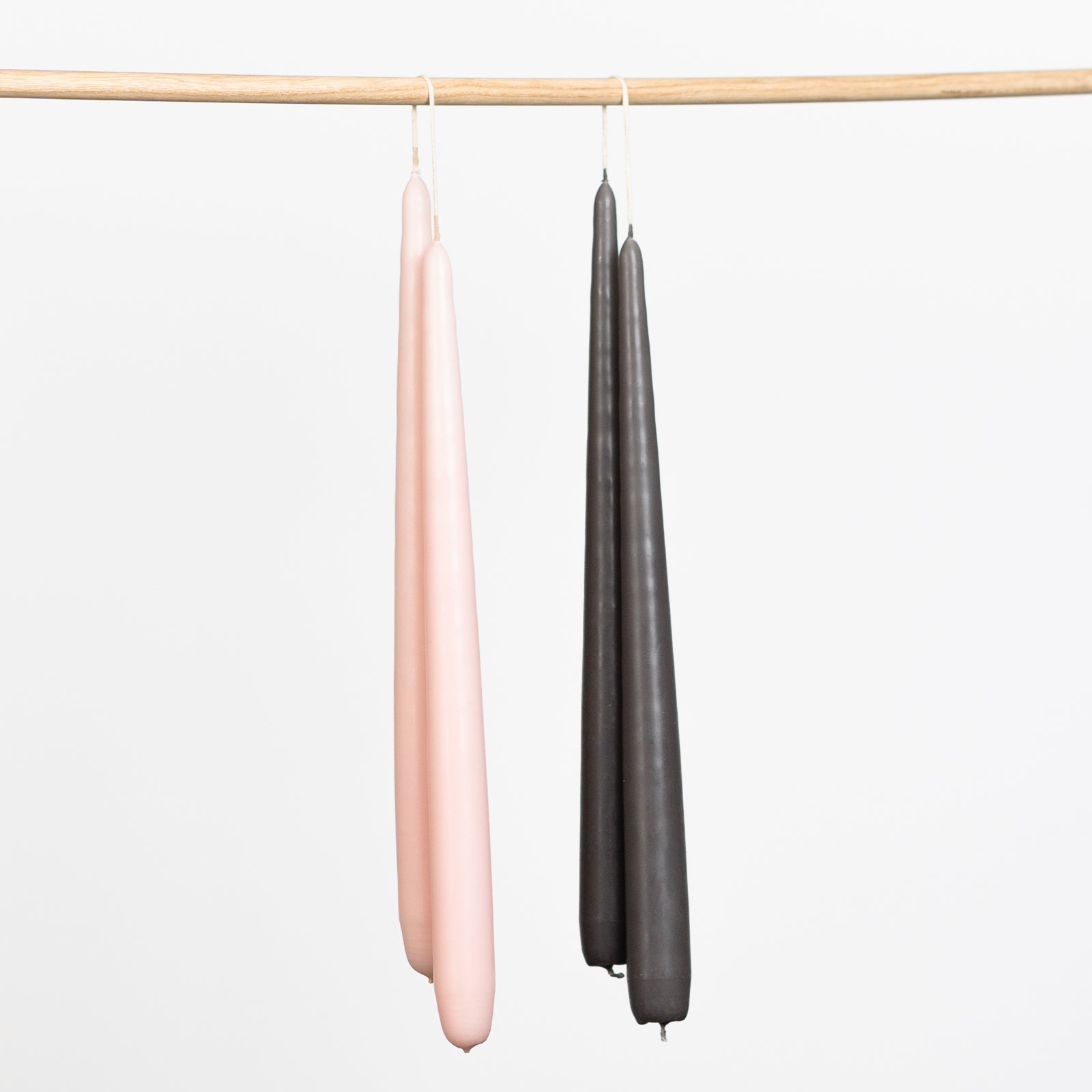 Tapered hand dipped dinner candles 28cm in pink