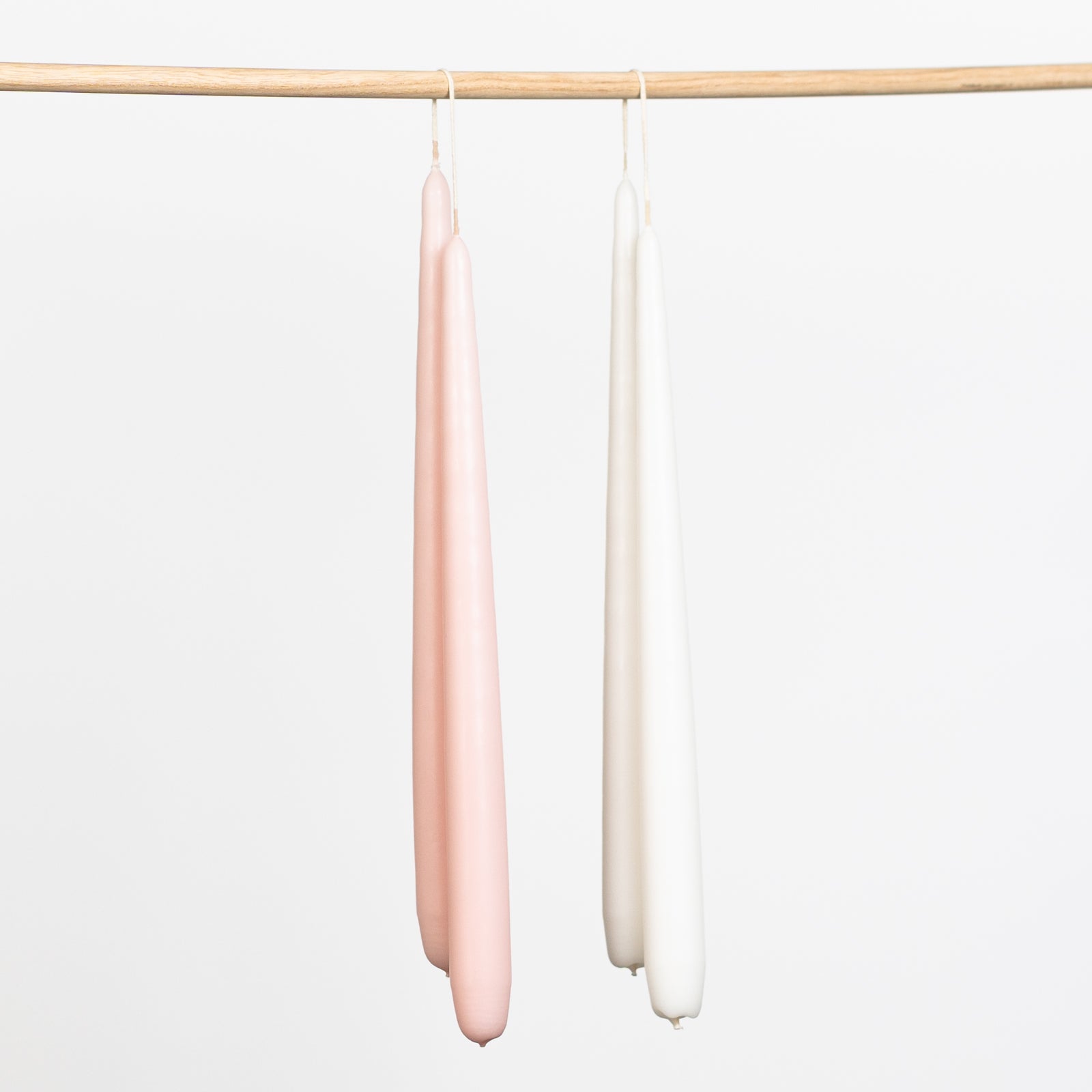Tapered hand dipped dinner candles 28cm in pink