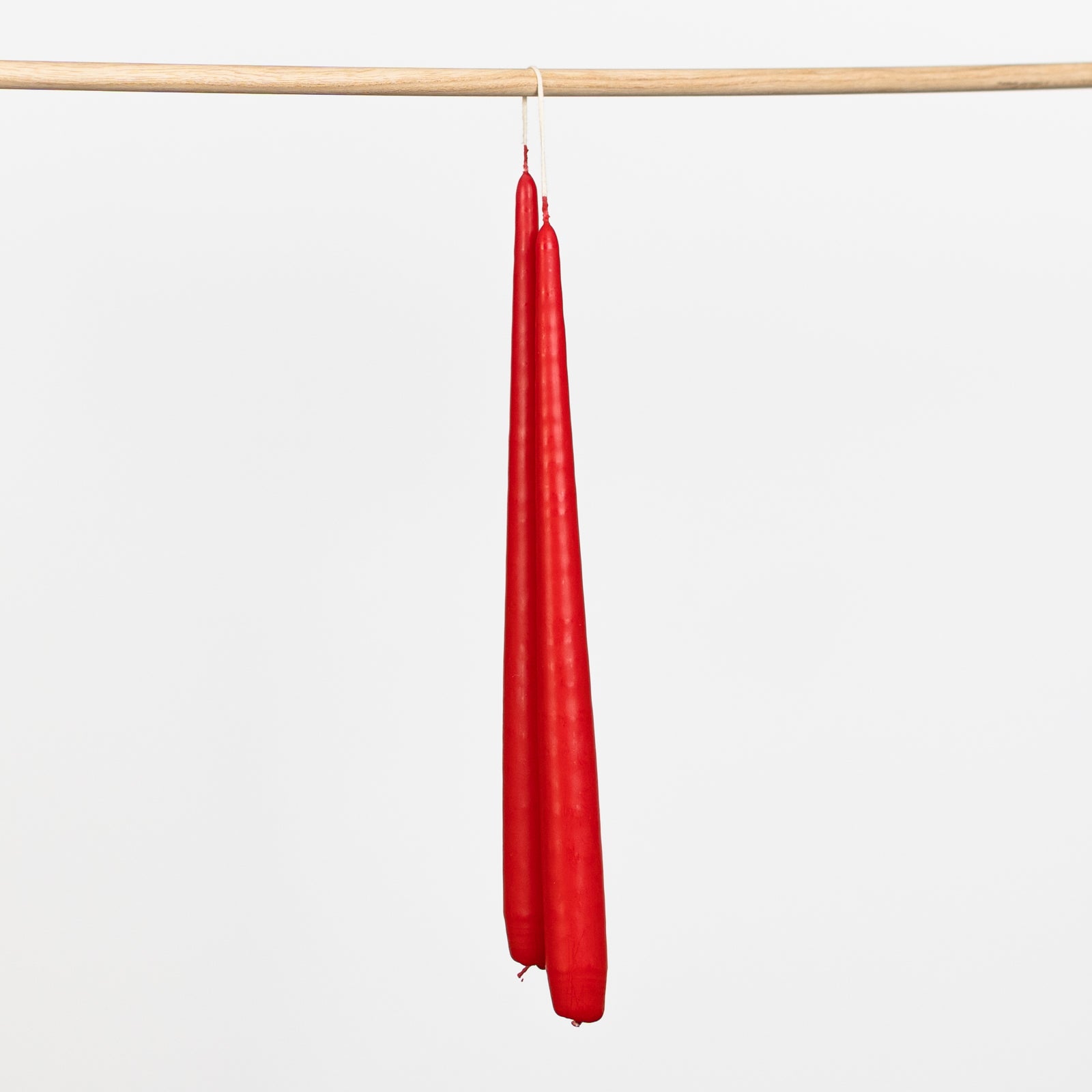 Tapered hand dipped dinner candles 28cm in red