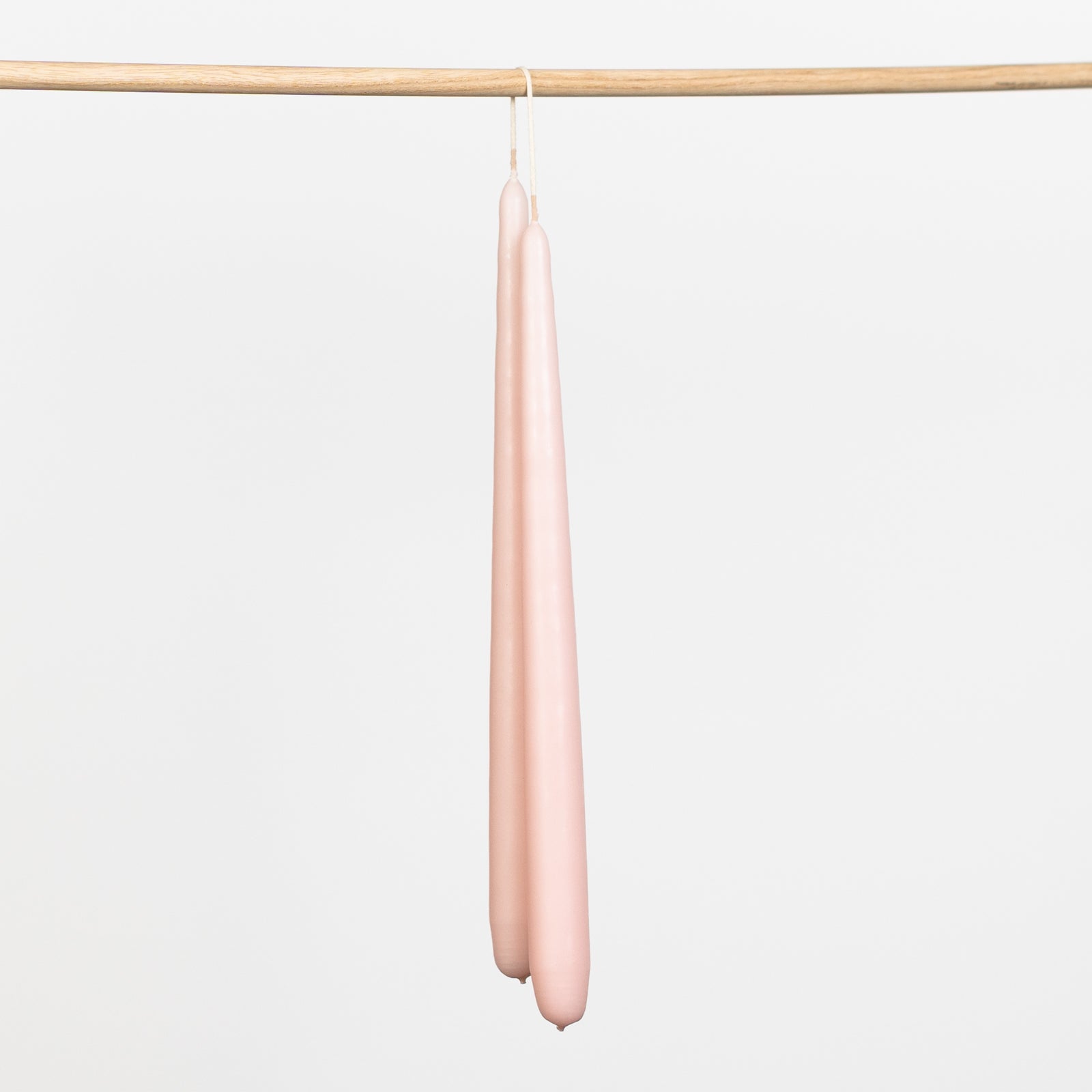Tapered hand dipped dinner candles 28cm in pink