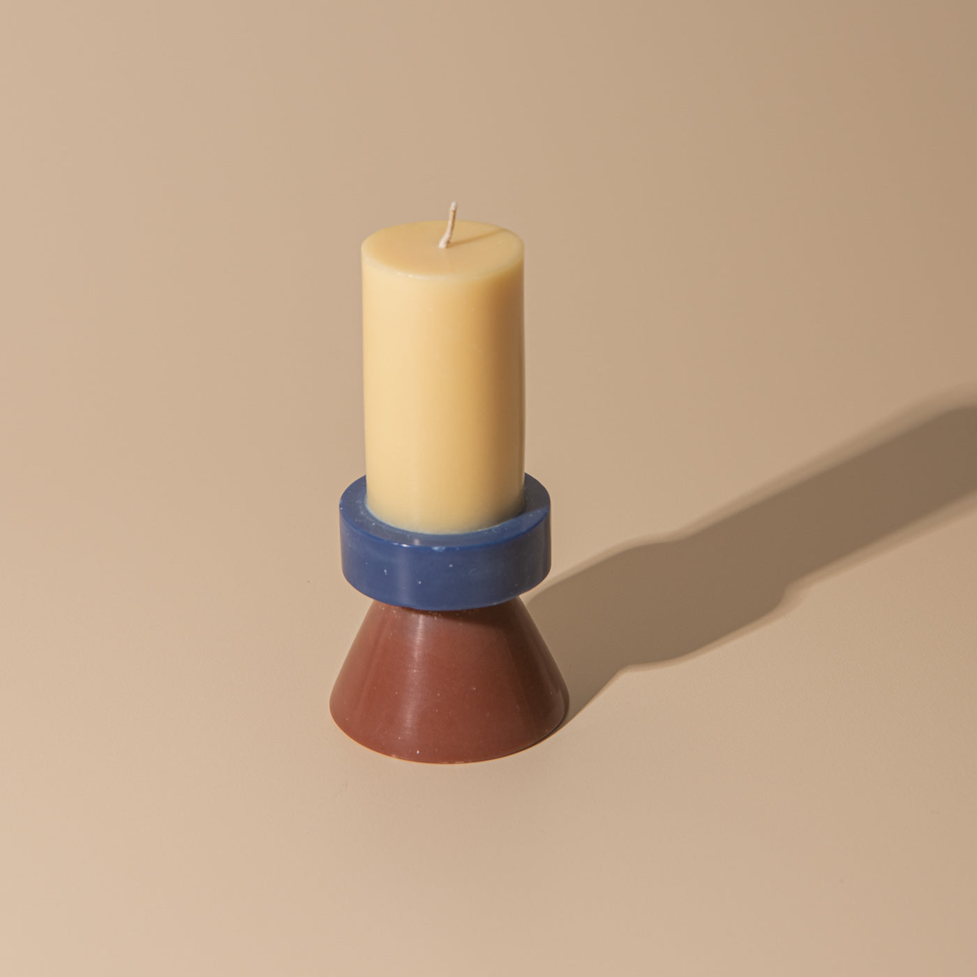 Stack Candle Tall, shaped candles by Yod and co in yellow, navy, brown